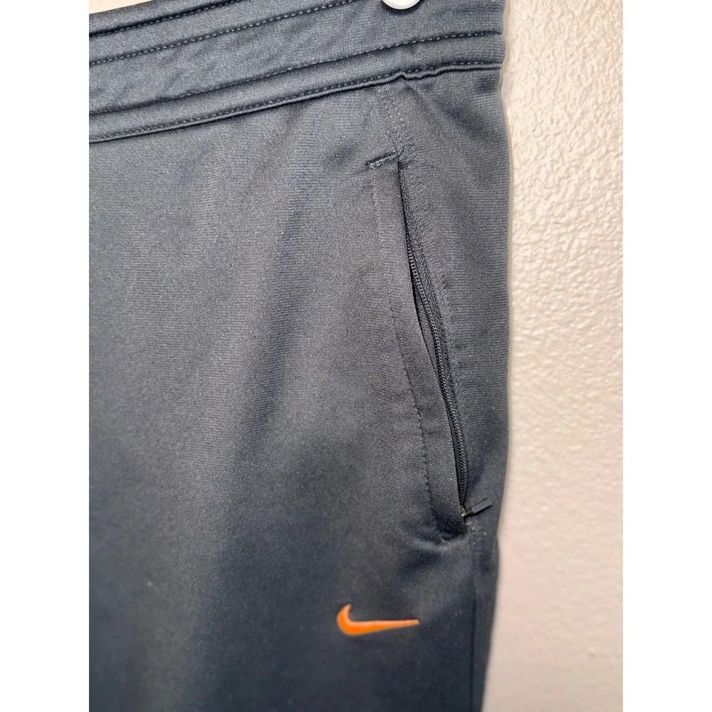 Nike Dri-FIT Women Black Cropped Athletic Joggers Zipper Pockets Orange Swoosh L